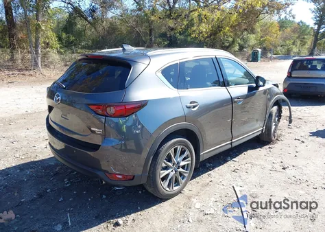 2021 Mazda Cx-5 Signature z USA, uszkodzony, nr VIN JM3KFBEY6M0449522